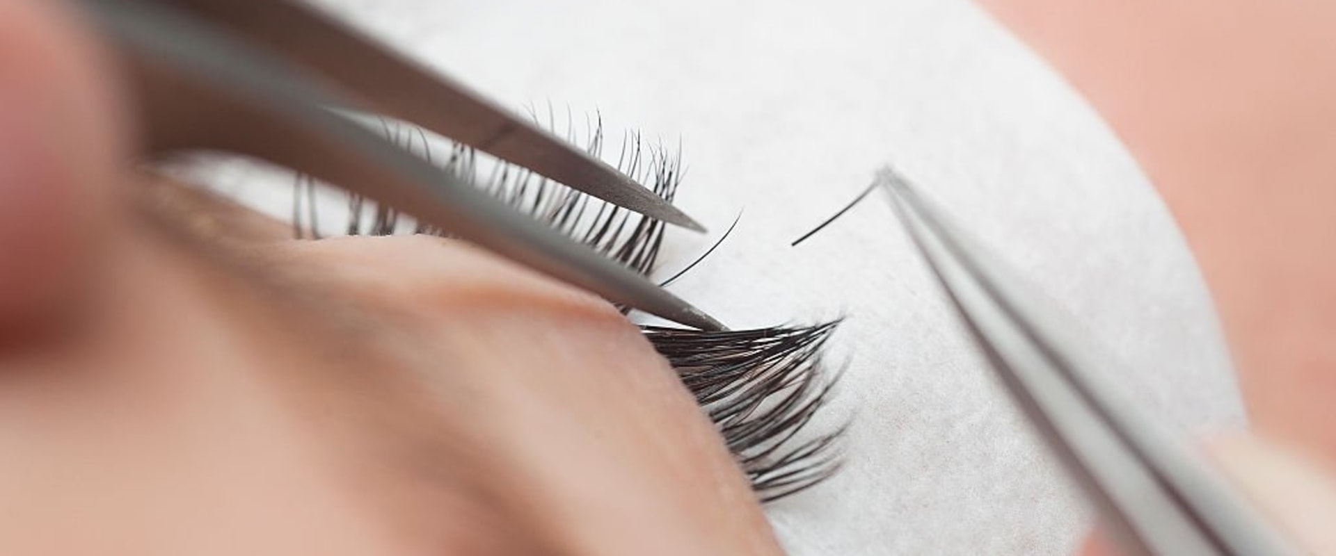Are eyelash extensions supposed to be glued to skin?
